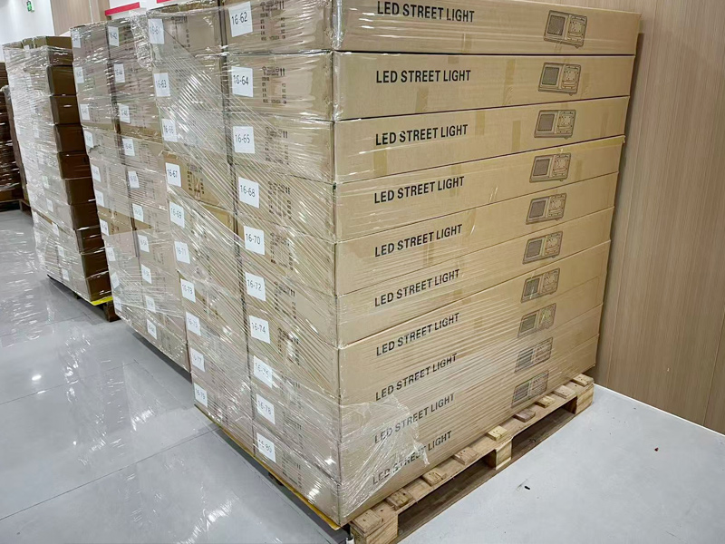 Pallets of solar street lights made up and strapped before loading